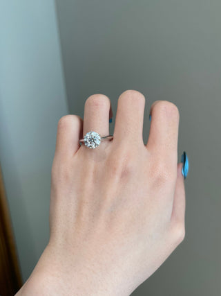 Gorgeous 3.0ct round solitaire moissanite ring angled view showing its sparkle