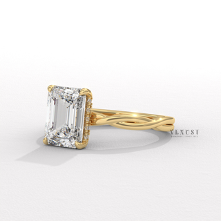 Lifestyle photo of a emerald cut moissanite engagement ring on an infinity band on the hand