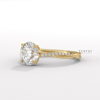 Round brilliant cut moissanite ring with flowing detail