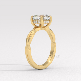 Full view of a cushion cut moissanite engagement ring on an infinity band with band detail