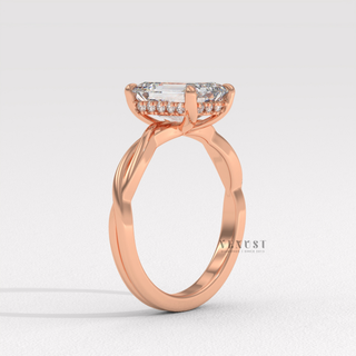 Side profile of a emerald cut moissanite engagement ring on an infinity band