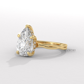 Profile shot of a pear cut moissanite engagement ring on an infinity band and its band