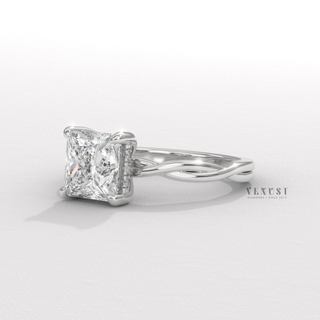 Side profile of a princess cut moissanite engagement ring on an infinity band