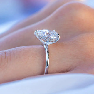 Bold 1.33ct pear hidden halo moissanite ring side profile view