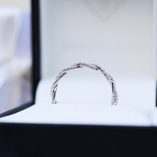 Delicate round full eternity moissanite wedding band detail view of the band