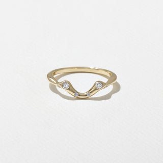 Vintage 2.0ct oval solitaire moissanite wedding band shown on a finger