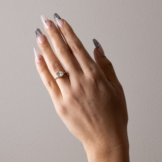Vintage 2.0ct oval solitaire moissanite wedding band tilted view catching the light