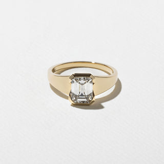 1.50ct Emerald Cut Diamond Bezel Cradled Band Engagement Ring