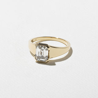 1.50ct Emerald Cut Diamond Bezel Cradled Band Engagement Ring