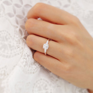 Classic 1.0ct round three stone moissanite ring shown on a finger