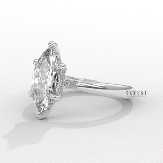 Detailed setting shot of a marquise cut moissanite engagement ring in a hidden halo solitaire setting