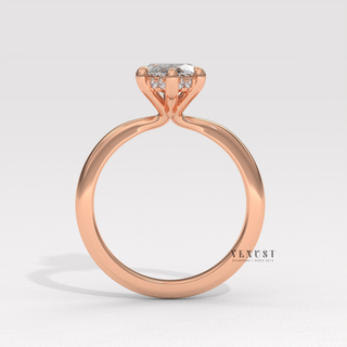 Lifestyle photo of a marquise cut moissanite engagement ring in a hidden halo solitaire setting on the hand