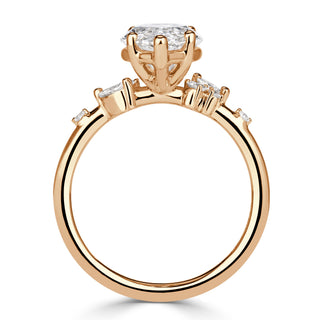 Marquise cluster moissanite engagement ring on hand