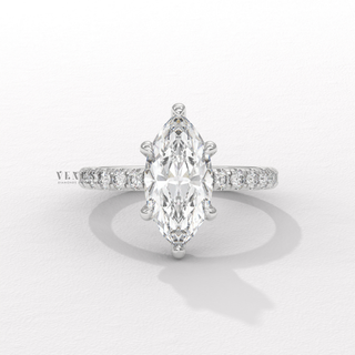 Front view of a marquise cut moissanite engagement ring with a hidden halo and pave band