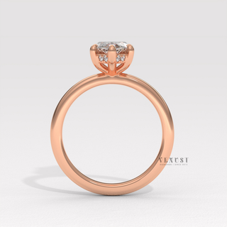 Front view of a marquise cut moissanite engagement ring in a hidden halo solitaire setting under soft light