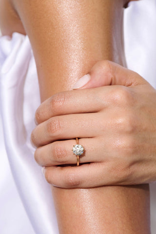 round cut moissanite engagement ring hand wearing view