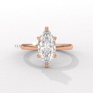 Close-up of a marquise cut moissanite engagement ring in a hidden halo solitaire setting