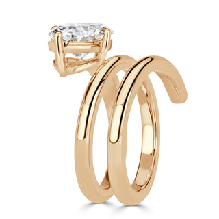 East west oval moissanite spring engagement ring on hand