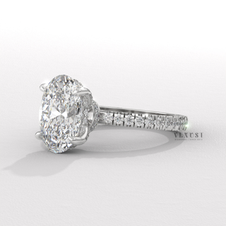 Front view of a oval cut moissanite engagement ring with a hidden halo and pave band