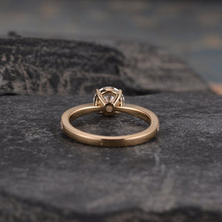 Sparkling 1.0ct round solitaire moissanite ring shown on a finger