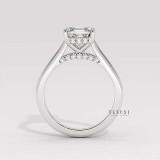 Front view of a asscher cut moissanite engagement ring with a hidden halo and cathedral setting under bright light