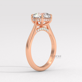 Profile shot of a cushion cut moissanite engagement ring with a hidden halo and cathedral setting and its band
