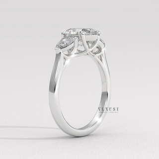 Oval three stone moissanite ring on hand