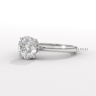 Round cut engagement ring with floral prong detail