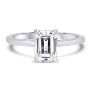 Classic 1.0ct emerald solitaire moissanite ring shown on a finger