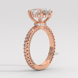 Top-down view of a oval cut moissanite engagement ring with a hidden halo and pave band
