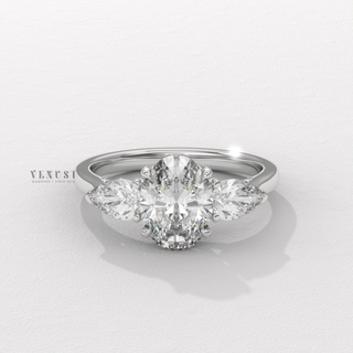 Oval shaped engagement ring with three stone setting