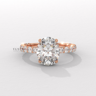 Oval cut moissanite ring with three quarter pave detail