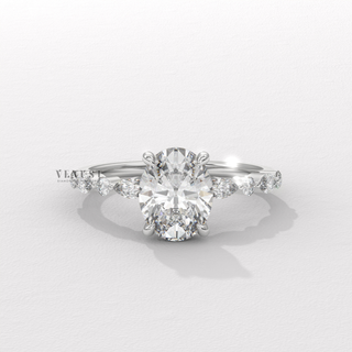 Oval shaped engagement ring with round pave stones