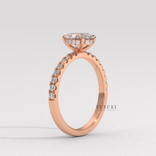 Hand model wearing a oval cut moissanite engagement ring with a hidden halo and half pave band