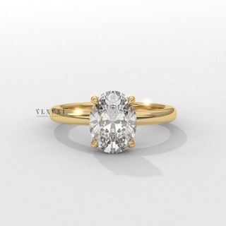 Front view of a oval cut moissanite engagement ring in a hidden halo solitaire setting in fine detail