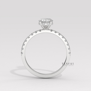 Lifestyle photo of a oval cut moissanite engagement ring with a hidden halo and half pave band on the hand