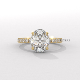 Lifestyle photo of a oval cut moissanite engagement ring with a pave band on the hand