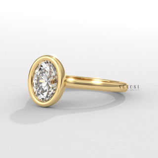 Bezel oval moissanite ring angled view