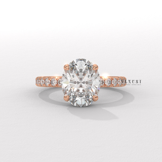 Profile shot of a oval cut moissanite engagement ring with a pave band and its band