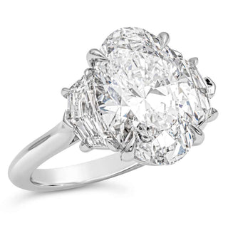 Elongated oval three stone moissanite engagement ring close up detail