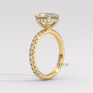 Close-up of a oval cut moissanite engagement ring with a pave band