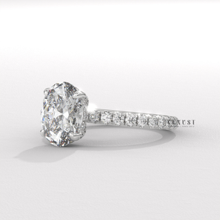 Side profile of a oval cut moissanite engagement ring with a pave band
