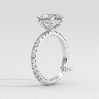Macro shot of the centre stone on a oval cut moissanite engagement ring with a pave band