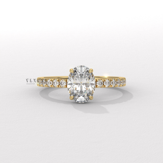 Oval cut moissanite engagement ring with a hidden halo and half pave band worn on a hand