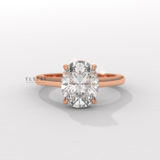 Macro shot of the centre stone on a oval cut moissanite engagement ring in a hidden halo solitaire setting