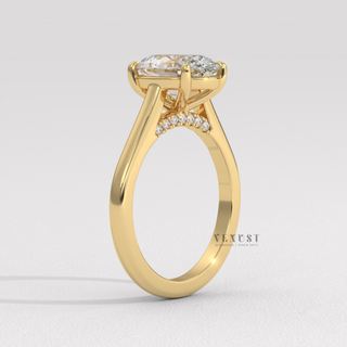 Front view of a oval cut moissanite engagement ring in a hidden halo solitaire setting under soft light