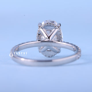Timeless 2.0ct oval hidden halo moissanite ring shown on a finger