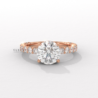 Round cut moissanite ring with three quarter pave detail