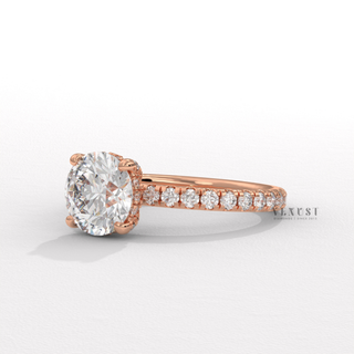 Close-up of a round cut moissanite engagement ring with a hidden halo and pave band