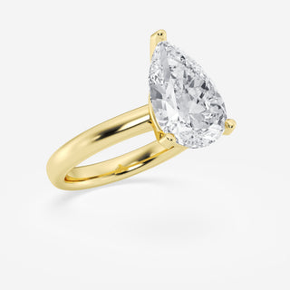 Delicate 1.0ct pear solitaire moissanite ring shown on a finger